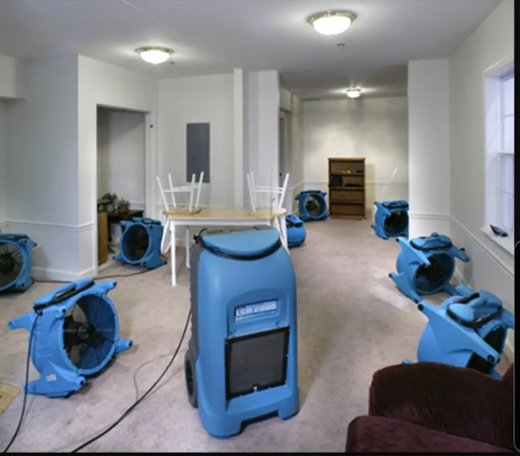 Air movers and dehumidifier setup for Water Damage Restoration in Hyrum